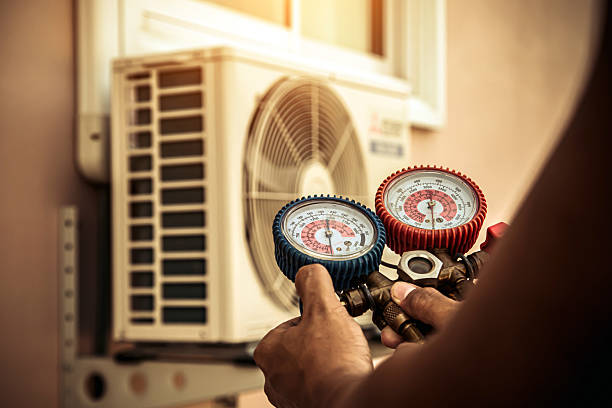 Professional Air Conditioning Service technician working in Hampton, KY